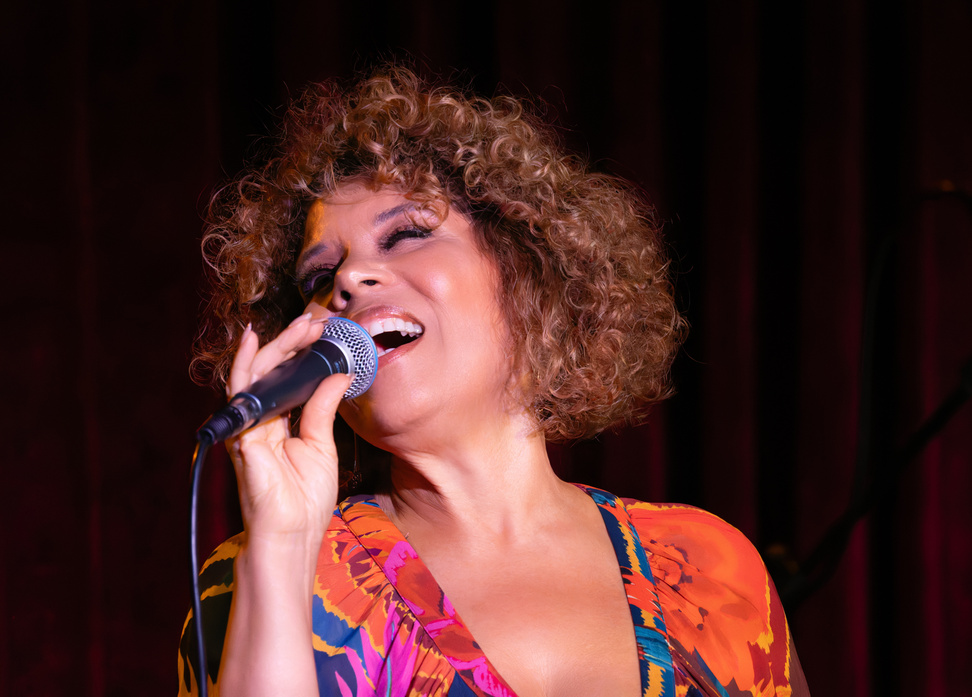 Amber Weekes singing on stage